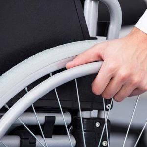 Person in wheelchair after catastrophic work injury