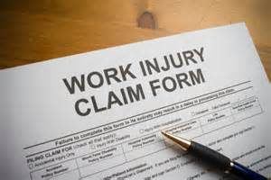 Work injury claim form with pen