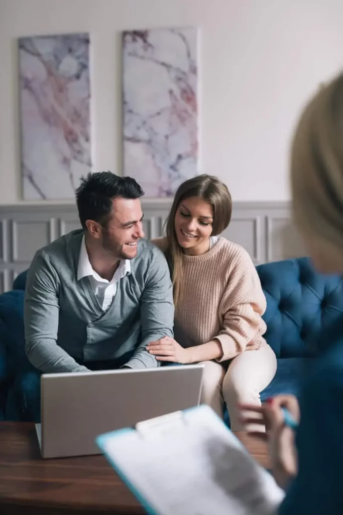 Happy couple visiting their attorney